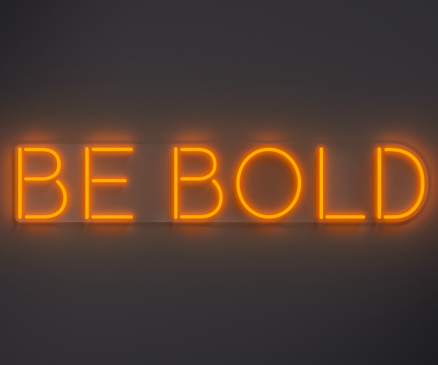 orange neon sign that says be bold