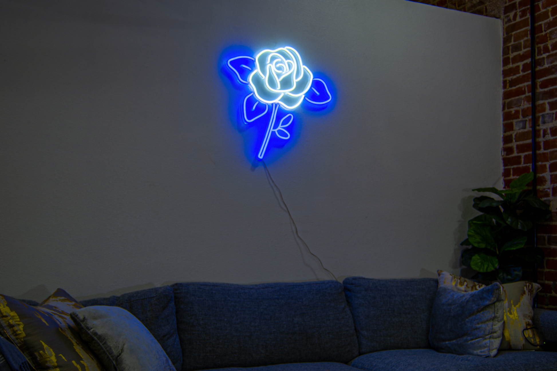 A white and blue flower neon sign