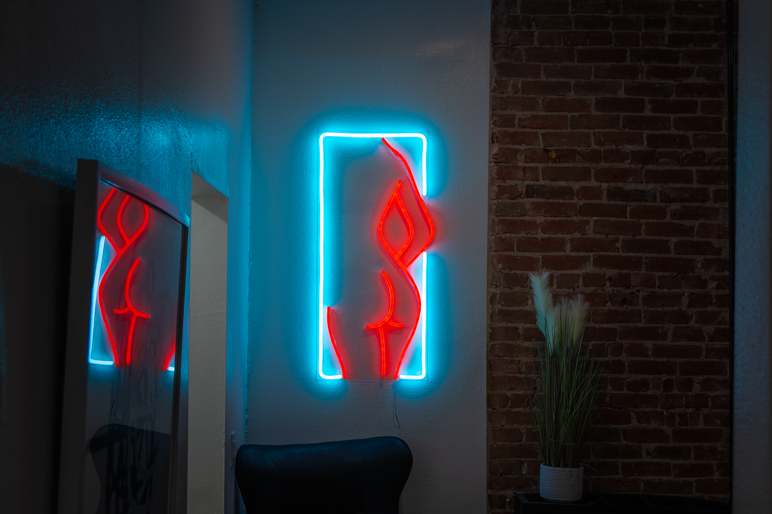 an aesthetic body outline neon sign