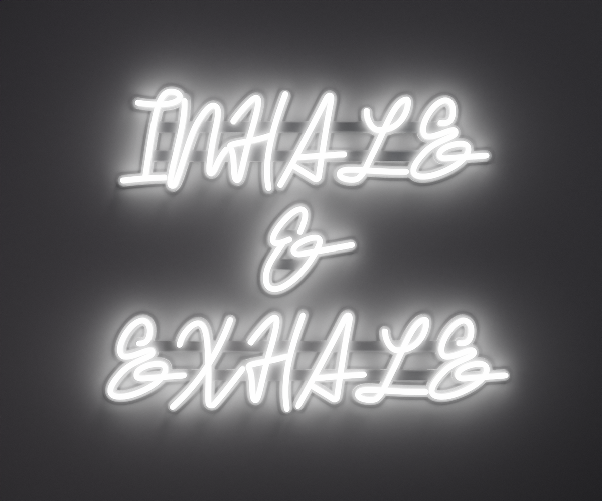 white neon sign that says inhale and exhale